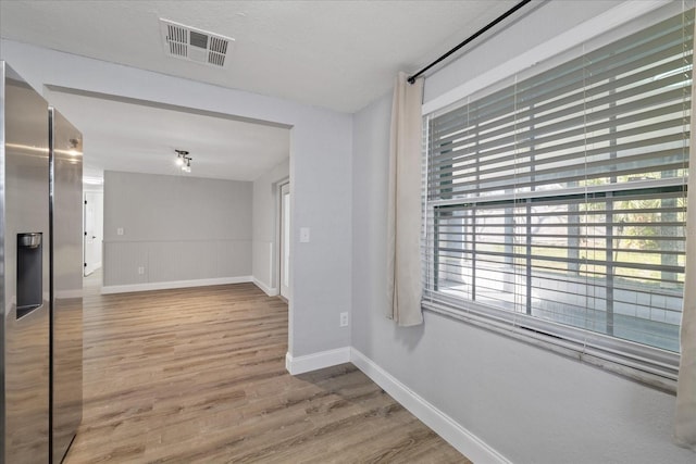 empty room featuring wood-type flooring