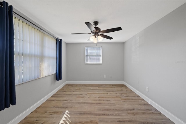 empty room featuring ceiling fan and light hardwood / wood-style floors