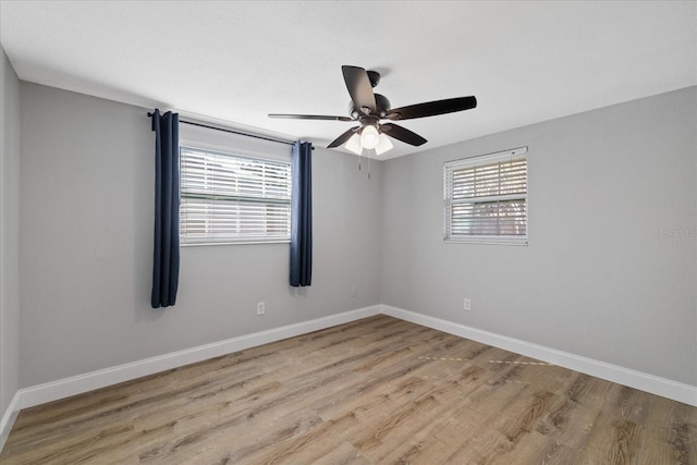 spare room featuring ceiling fan and light wood-type flooring