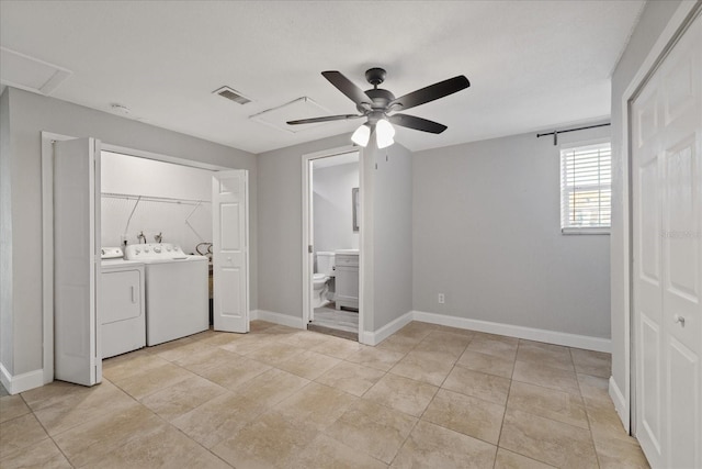 laundry area with light tile patterned flooring, separate washer and dryer, and ceiling fan