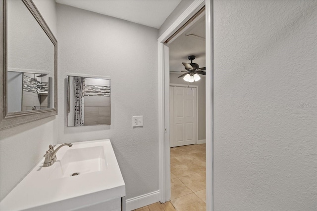 bathroom featuring ceiling fan, vanity, and tile patterned flooring