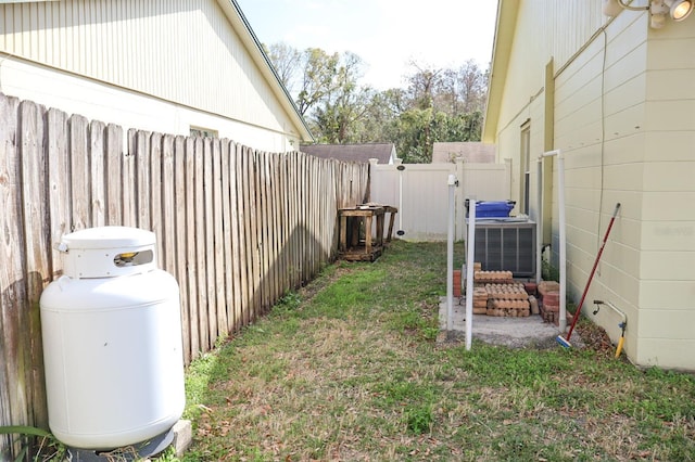 view of yard featuring central air condition unit