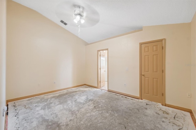 empty room featuring vaulted ceiling and ceiling fan