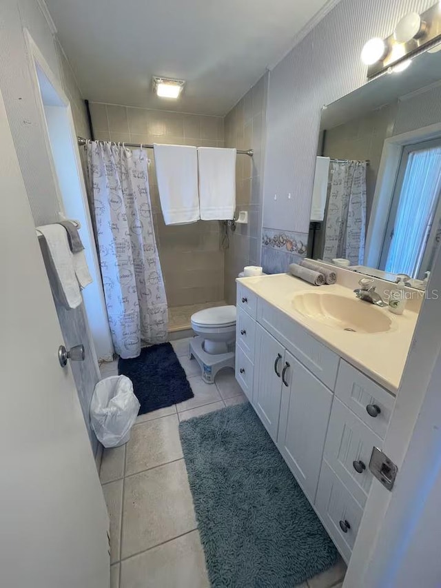 bathroom with vanity, a shower with curtain, tile patterned floors, and toilet