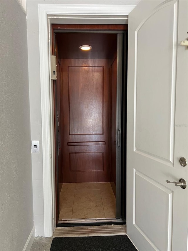1421 Apollo Beach Blvd, Apollo Beach, FL 33572 - corridor featuring baseboards and elevator