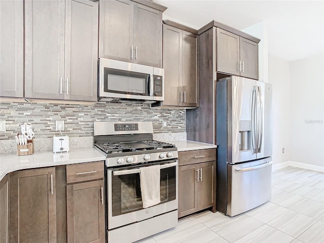 kitchen featuring appliances with stainless steel finishes and backsplash