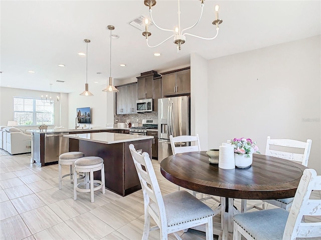 dining space with a notable chandelier