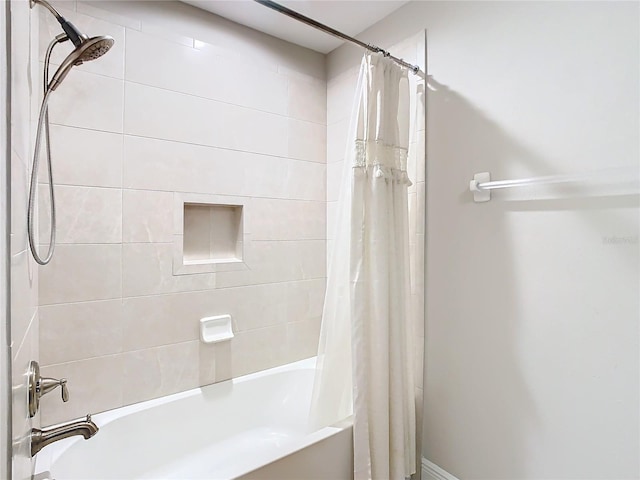 bathroom featuring shower / tub combo with curtain