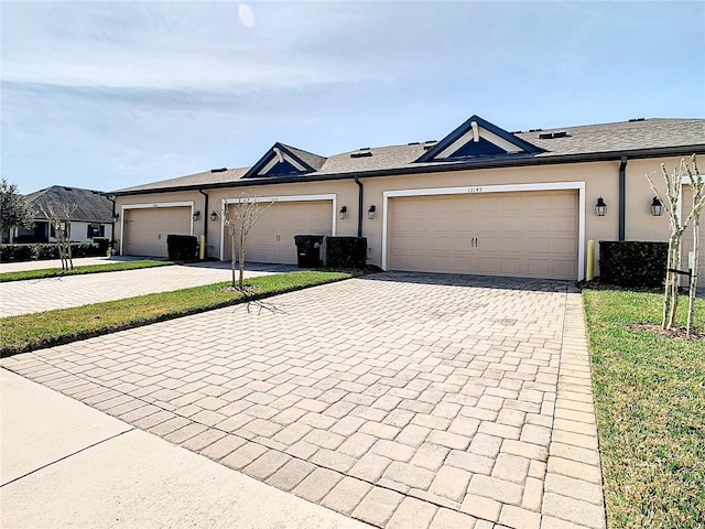 ranch-style house featuring a garage