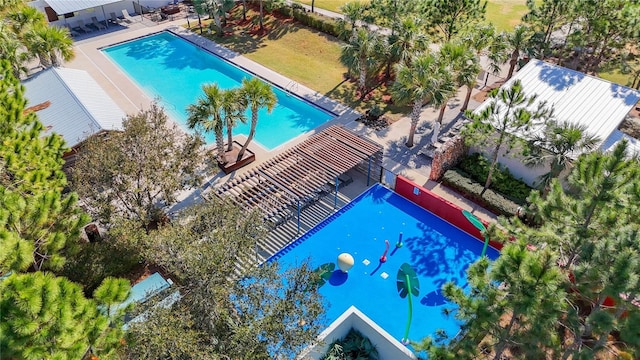 view of swimming pool with a pergola