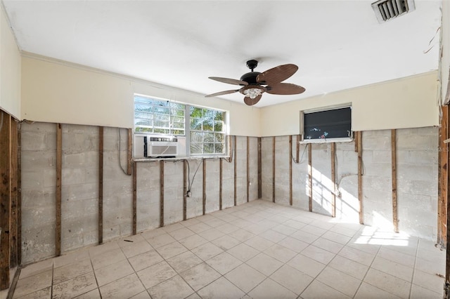 basement with cooling unit and ceiling fan