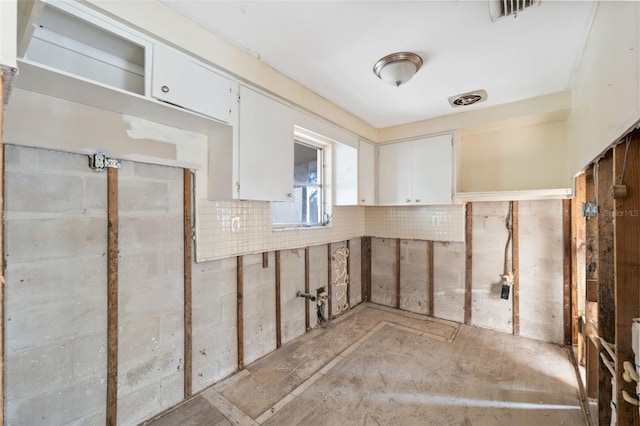 interior space featuring white cabinetry