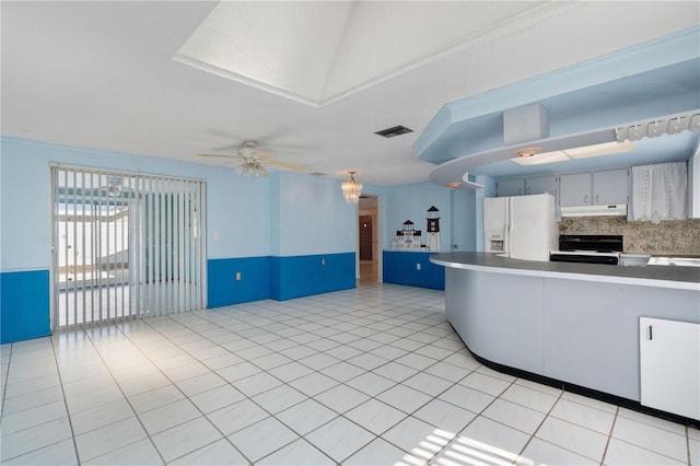 kitchen with backsplash, white fridge with ice dispenser, light tile patterned floors, ceiling fan, and electric stove