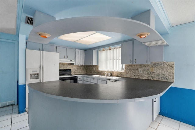 kitchen with black electric range oven, sink, tasteful backsplash, light tile patterned flooring, and kitchen peninsula