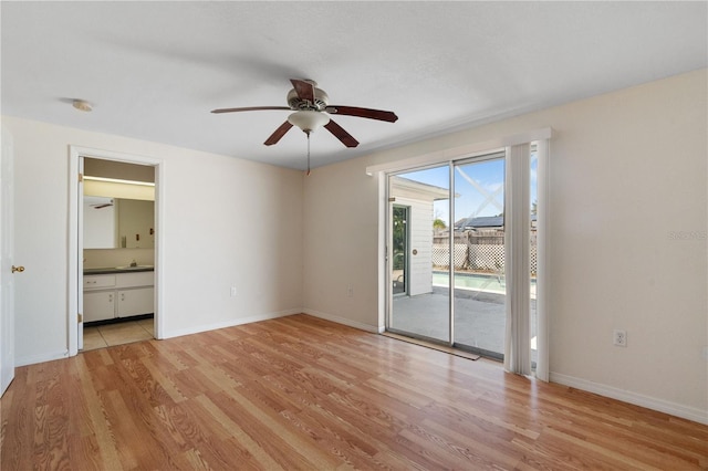 spare room featuring ceiling fan and light hardwood / wood-style floors