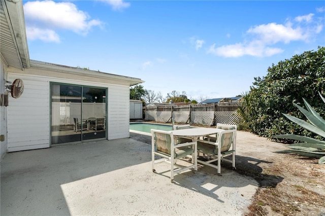 view of patio / terrace featuring a fenced in pool