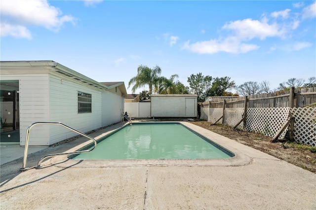 view of pool featuring a shed