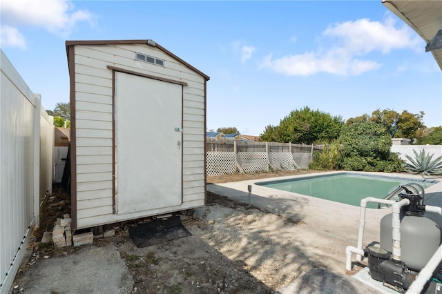 view of pool with a shed