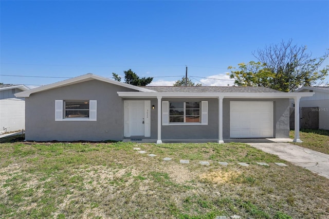 ranch-style house with an attached garage, fence, concrete driveway, stucco siding, and a front yard