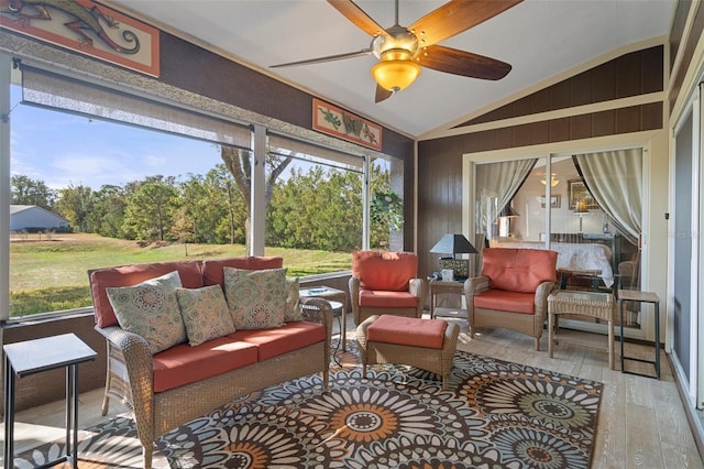 sunroom / solarium with vaulted ceiling and ceiling fan