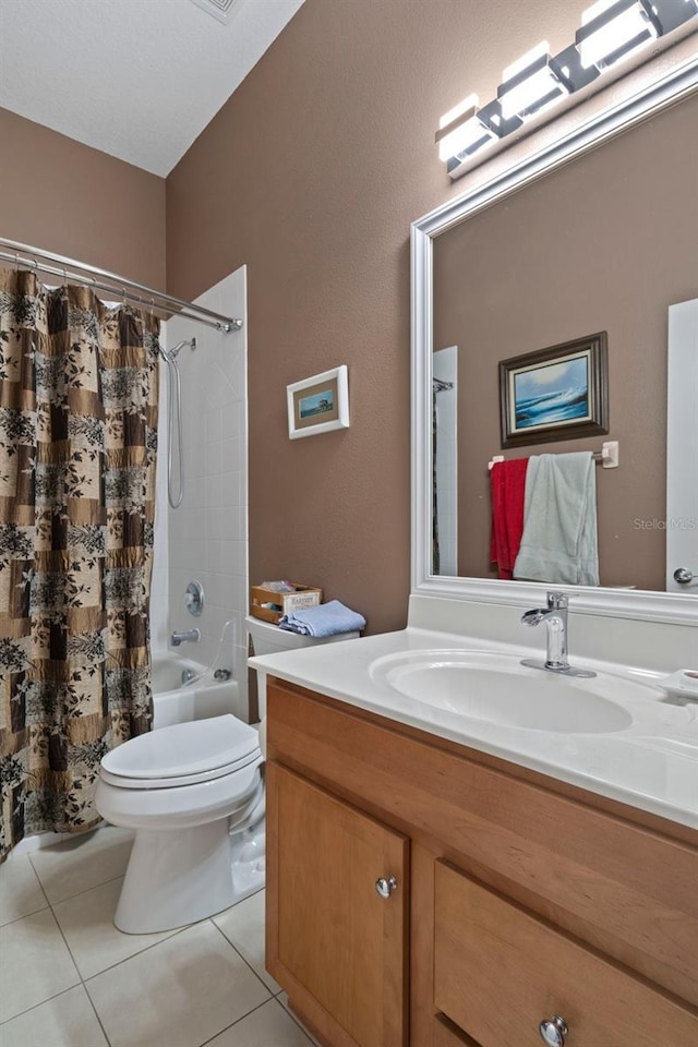 full bathroom featuring shower / tub combo with curtain, vanity, tile patterned flooring, and toilet