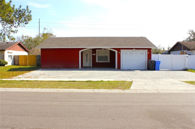 single story home with a garage