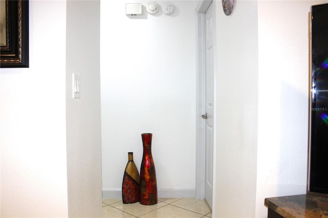 hallway featuring light tile patterned flooring