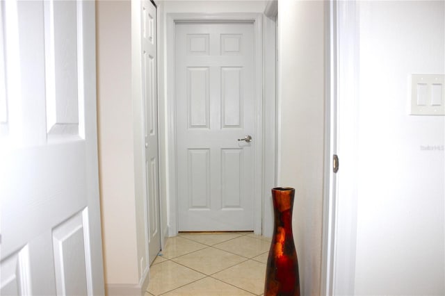 hallway with light tile patterned floors