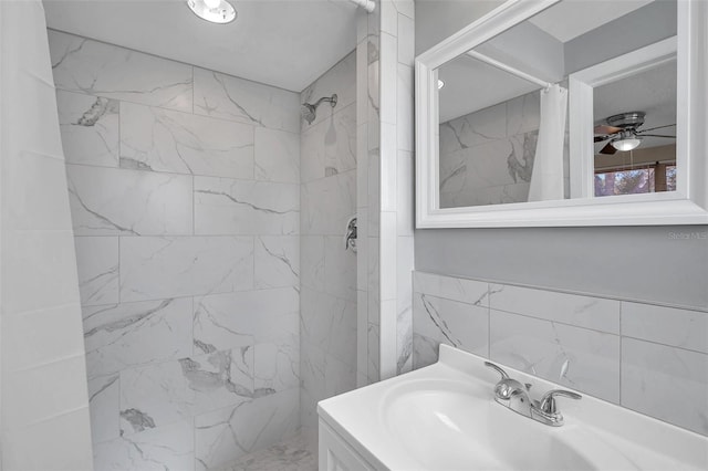 bathroom with ceiling fan, vanity, and a shower with shower curtain