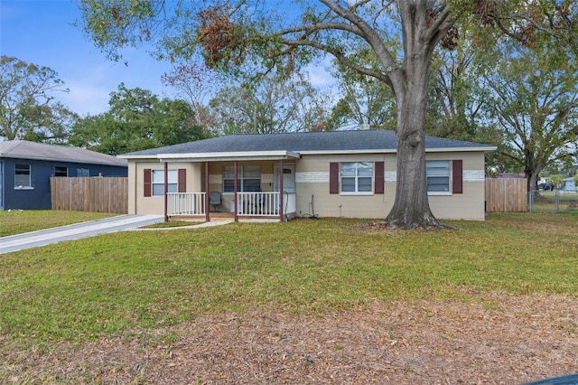 ranch-style home with a porch and a front lawn