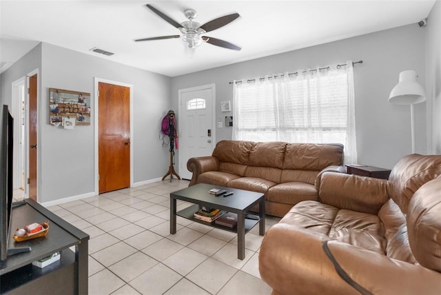 tiled living room featuring ceiling fan