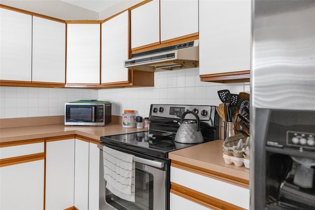 kitchen with tasteful backsplash, stainless steel appliances, and white cabinets