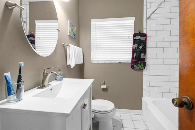 full bathroom featuring tile patterned floors, vanity, toilet, and tiled shower / bath