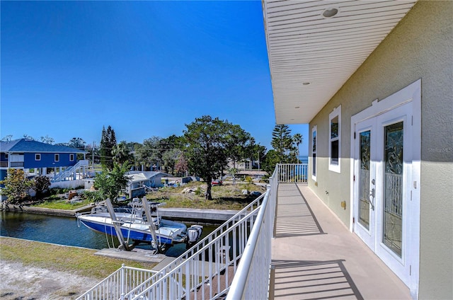 6801 Nowiki Ave, Hudson, FL 34667 - balcony with a water view, stairs, and a dock