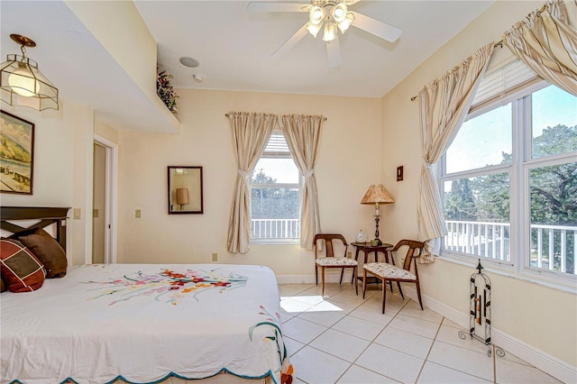 6801 Nowiki Ave, Hudson, FL 34667 - bedroom with baseboards, ceiling fan, and light tile patterned flooring