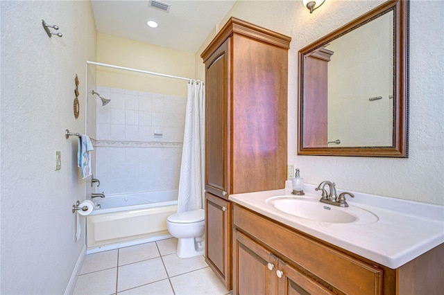 6801 Nowiki Ave, Hudson, FL 34667 - bathroom with toilet, a textured wall, tile patterned floors, and visible vents