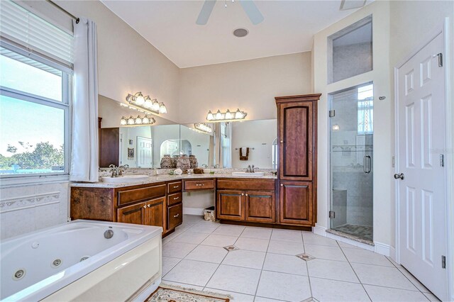 6801 Nowiki Ave, Hudson, FL 34667 - full bath featuring a whirlpool tub, a shower stall, tile patterned floors, and a sink