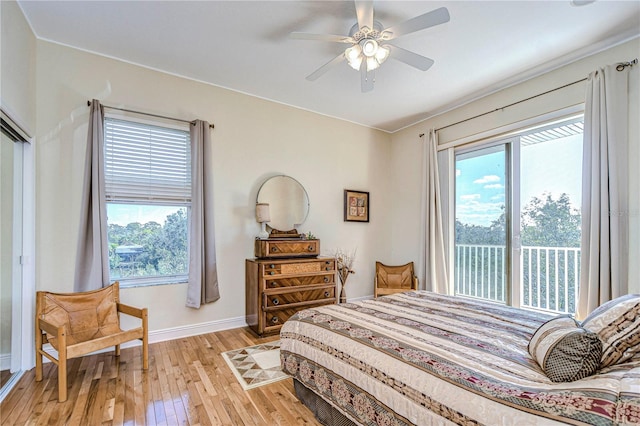 6801 Nowiki Ave, Hudson, FL 34667 - bedroom featuring light wood-style floors, access to outside, baseboards, and ceiling fan