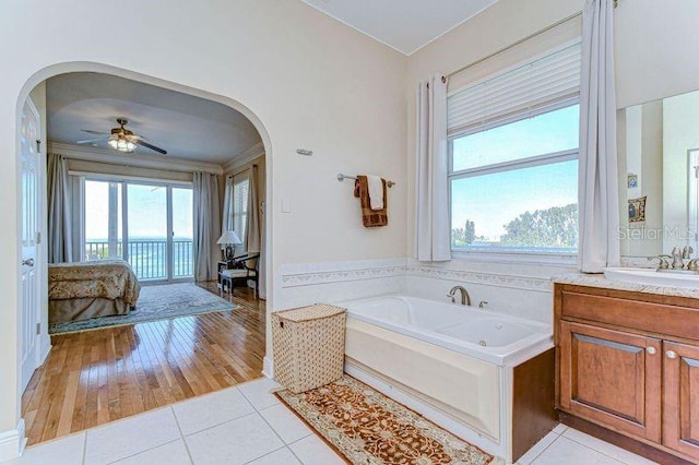 6801 Nowiki Ave, Hudson, FL 34667 - ensuite bathroom with a bath, a wealth of natural light, tile patterned flooring, and vanity
