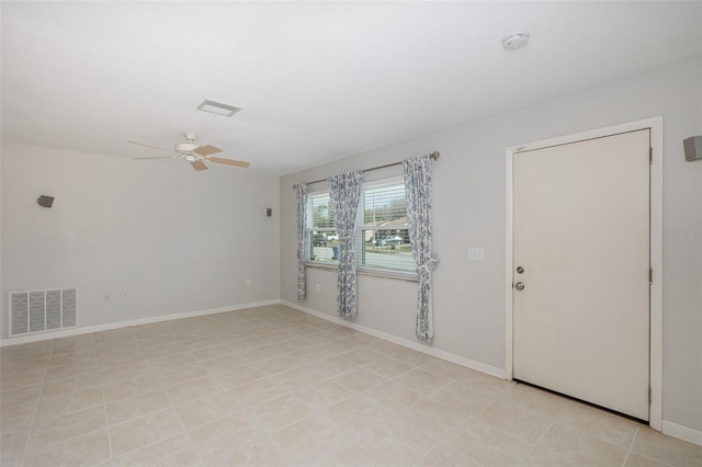 unfurnished room featuring ceiling fan