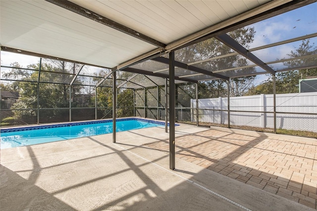 view of swimming pool with a lanai and a patio area