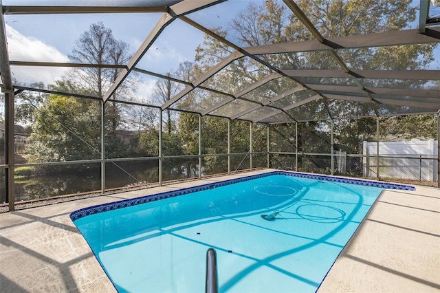 view of pool featuring a patio and glass enclosure