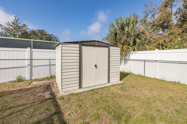 view of outbuilding with a lawn