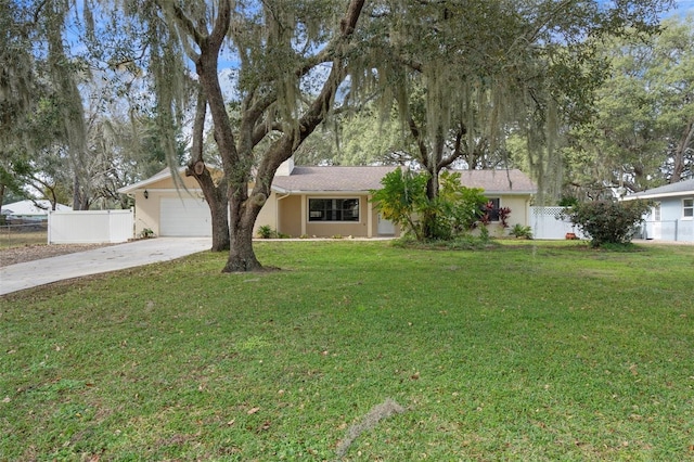 single story home featuring a garage and a front yard