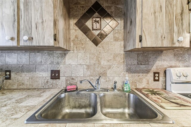 kitchen with tasteful backsplash and sink