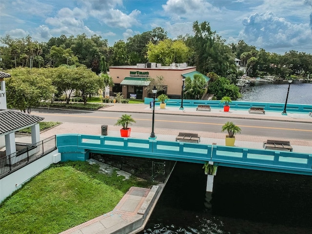 surrounding community with a water view