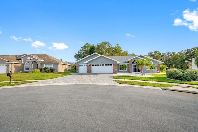 ranch-style home with a garage and a front lawn