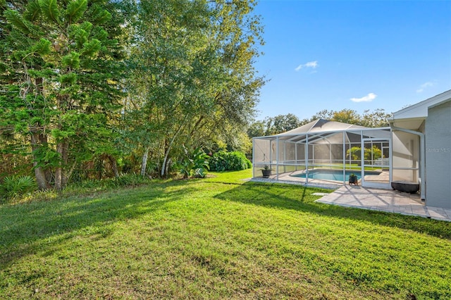 view of yard with a lanai and a patio