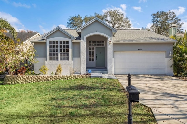 ranch-style house with a garage and a front lawn