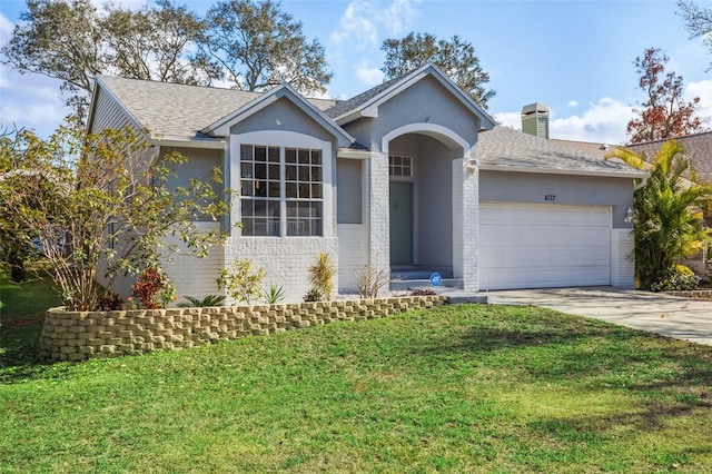 ranch-style home featuring a garage and a front yard